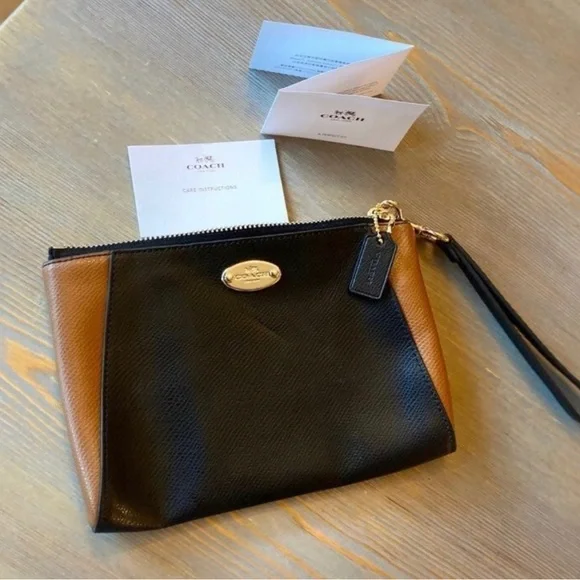 Coach colorblock wristlet. 100% authentic. Measures 8 1/2” x 5 3/4”. - Picture 1 of 3